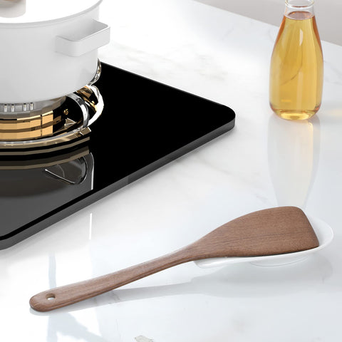 ONTUBE white porcelain spoon rest close-up with smooth glaze for easy cleaning.