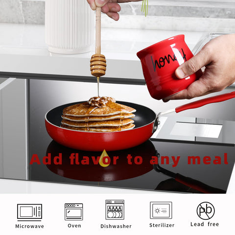 Honey jar on a table top with red glaze, ready for service.