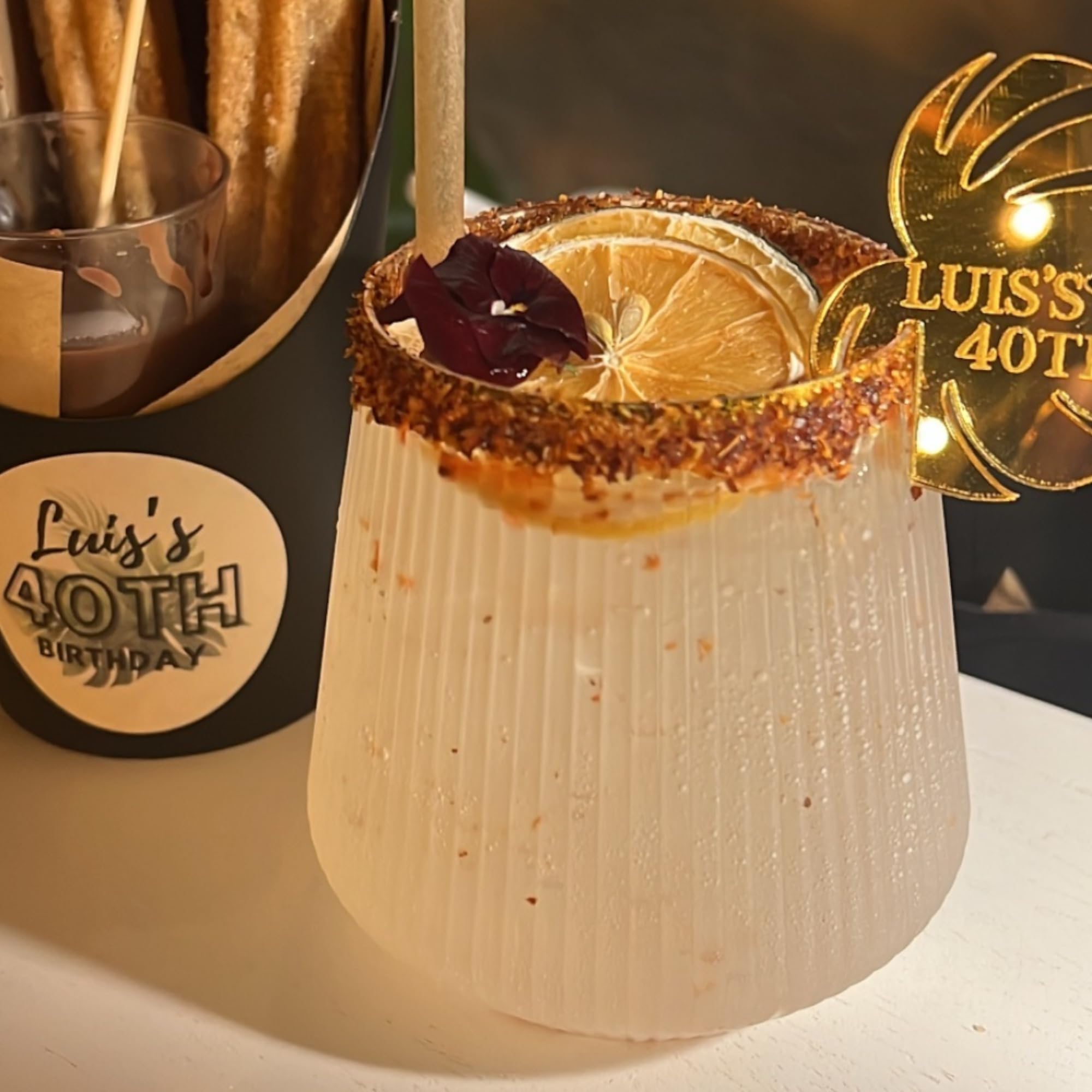 Oojami gold-rim stemless glass highlighting elegant presentation on any table.
