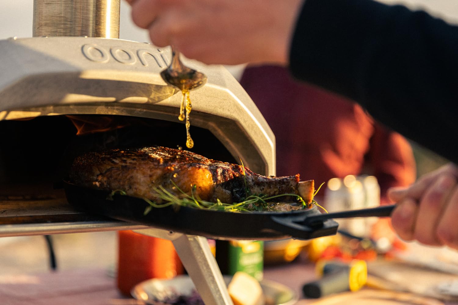 Ooni Cast Iron Sizzler Pan ideal for steak, veggies, and fish cooking.