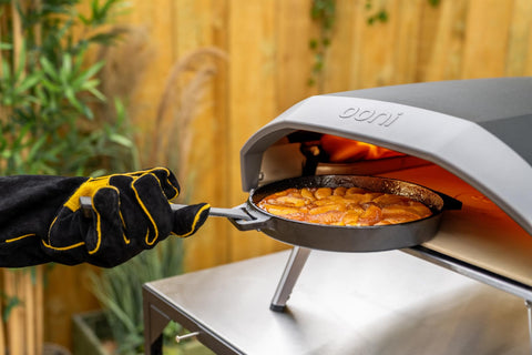 Ooni skillet showing seasoned cooking surface for durability.