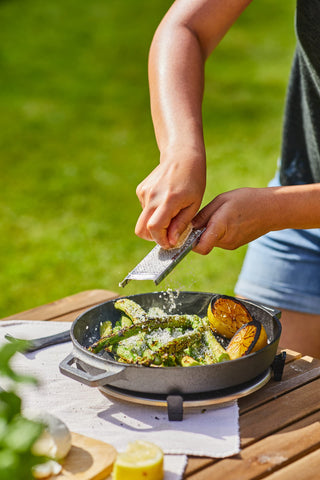 Ooni skillet includes stainless steel trivet for protection.