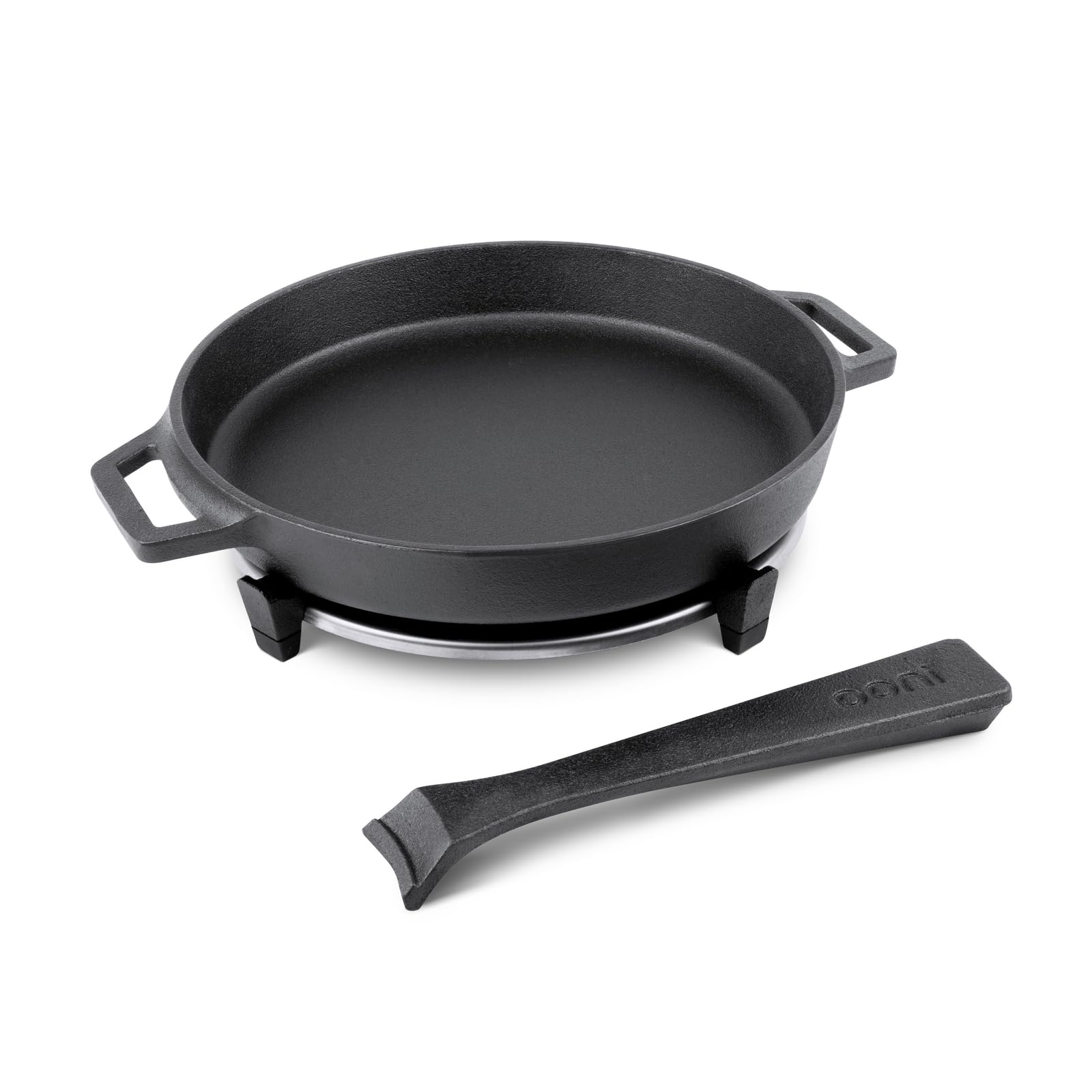 Ooni cast iron skillet on stovetop for even searing.