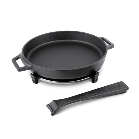 Ooni cast iron skillet on stovetop for even searing.