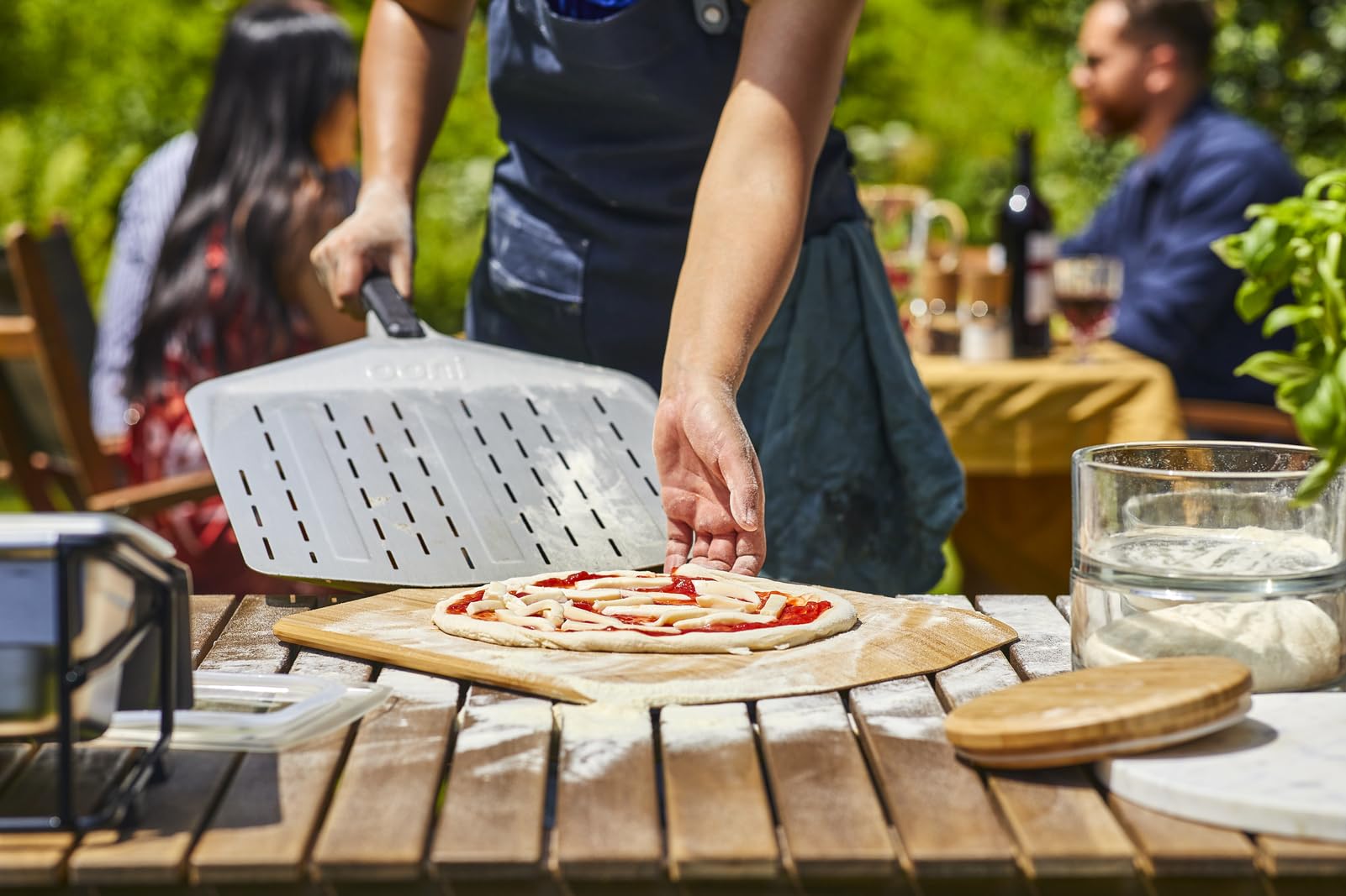 Ooni perforated pizza peel aluminum finish offers lightweight handling.
