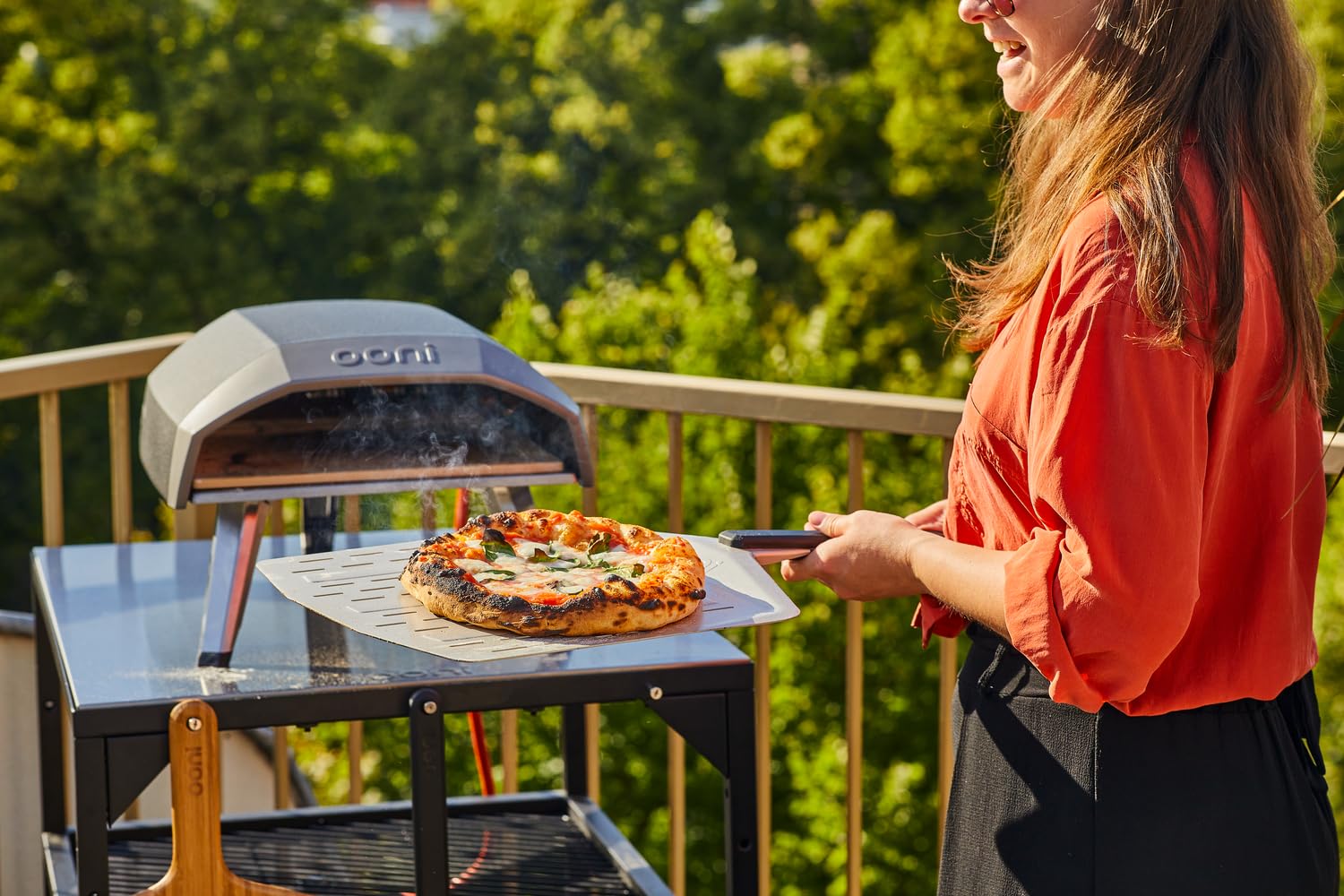 Ooni perforated pizza peel surface helps excess flour fall through.