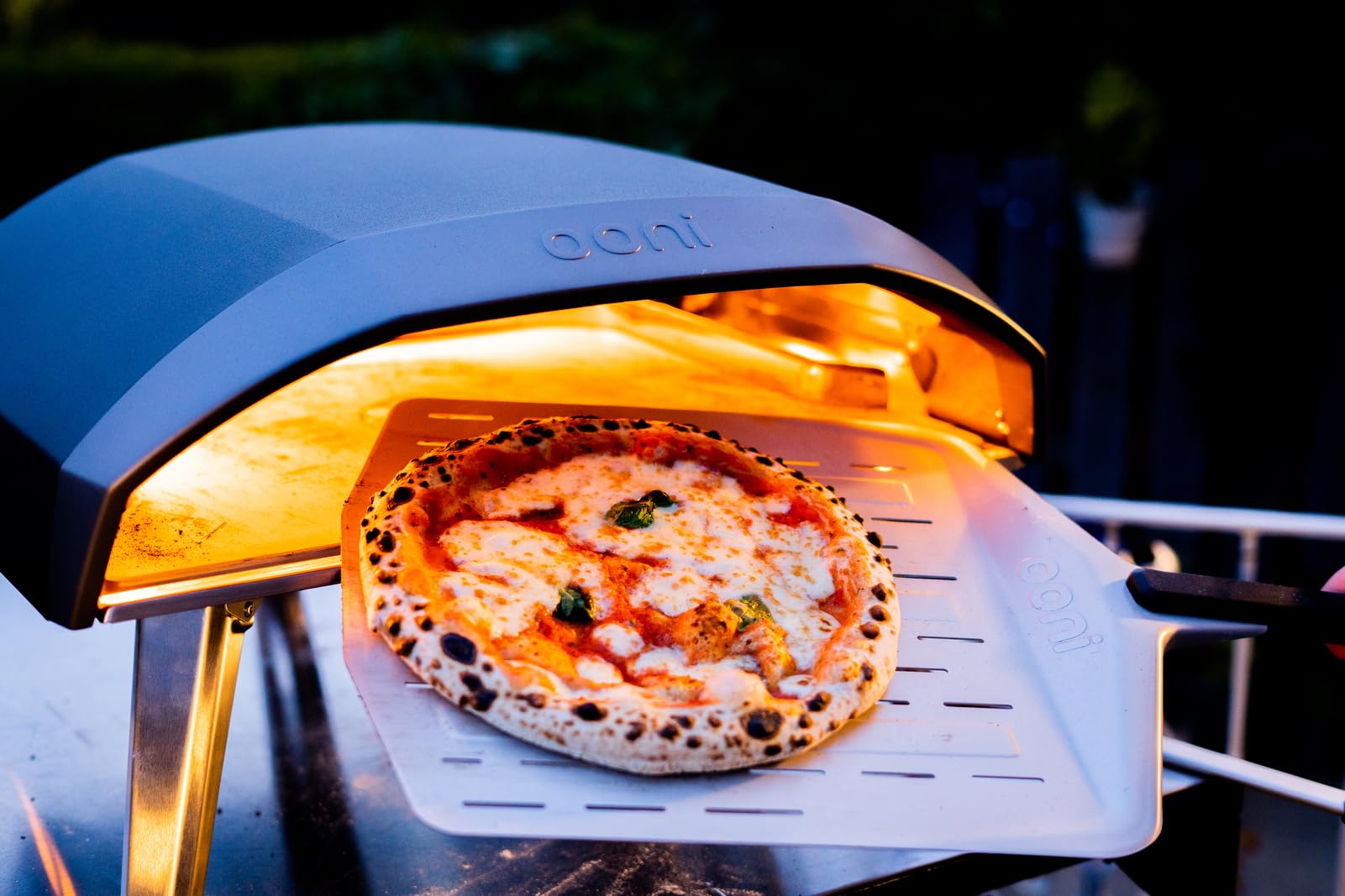 Ooni perforated pizza peel perforations detail aids crisp crust.