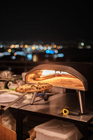 Ooni pizza turning peel cleans easily after cooking.