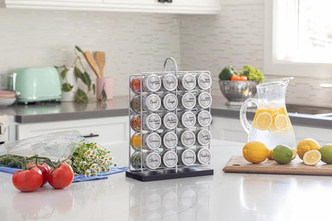 Orii spice jars with stainless steel caps arranged in rack for freshness.