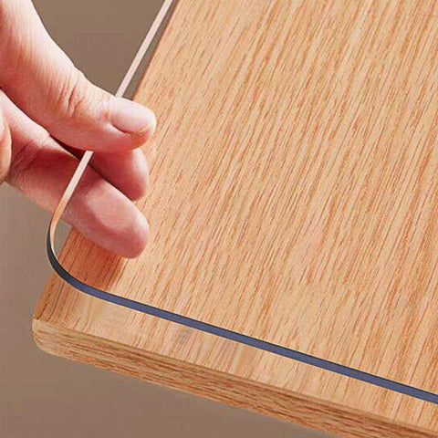 OstepDecor clear table cover on a 36x60-inch surface protects against spills and scratches.