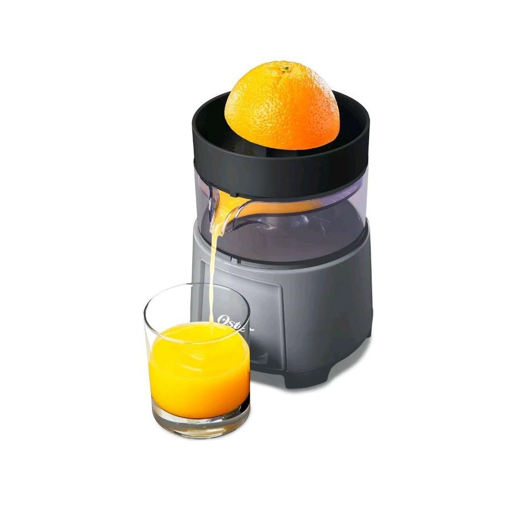 Oster electric citrus juicer juicing action delivering fresh juice quickly into a glass.
