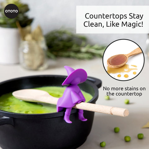 OTOTO Agatha witch spoon holder resting on a burner for easy reach.