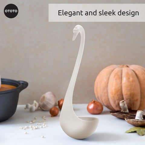 Swanky Swan ladle serves soup into bowls for a chic presentation