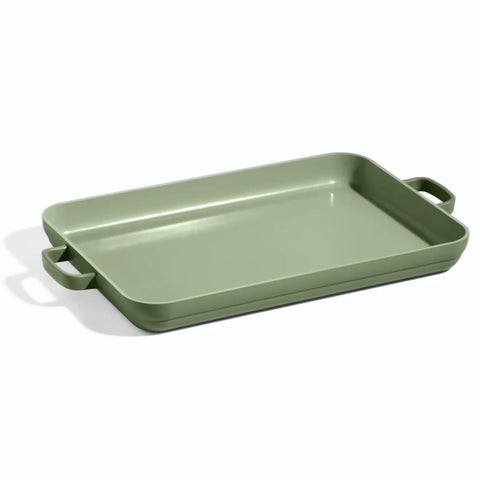 Our Place Griddle Pan on two burners showing a spacious cooking surface for multiple foods.