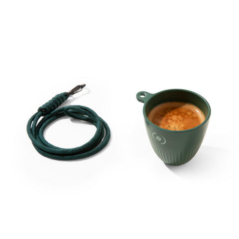 OutIn espresso cup clipped on a bag for on-the-go coffee.