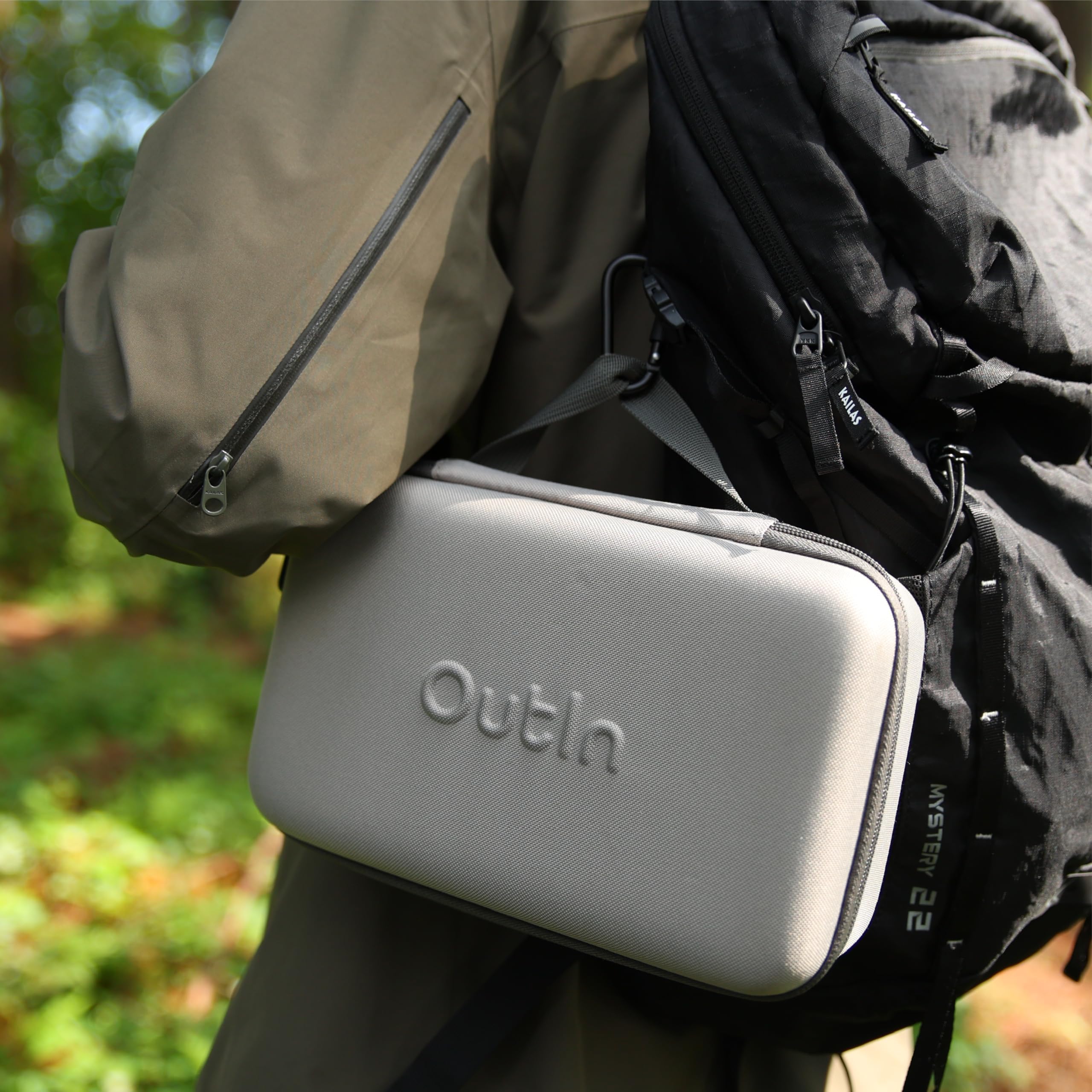 OutIn portable case attached to backpack while camping.