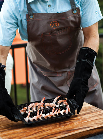 Outset cast iron pan transferred from cooktop to table for versatile cooking