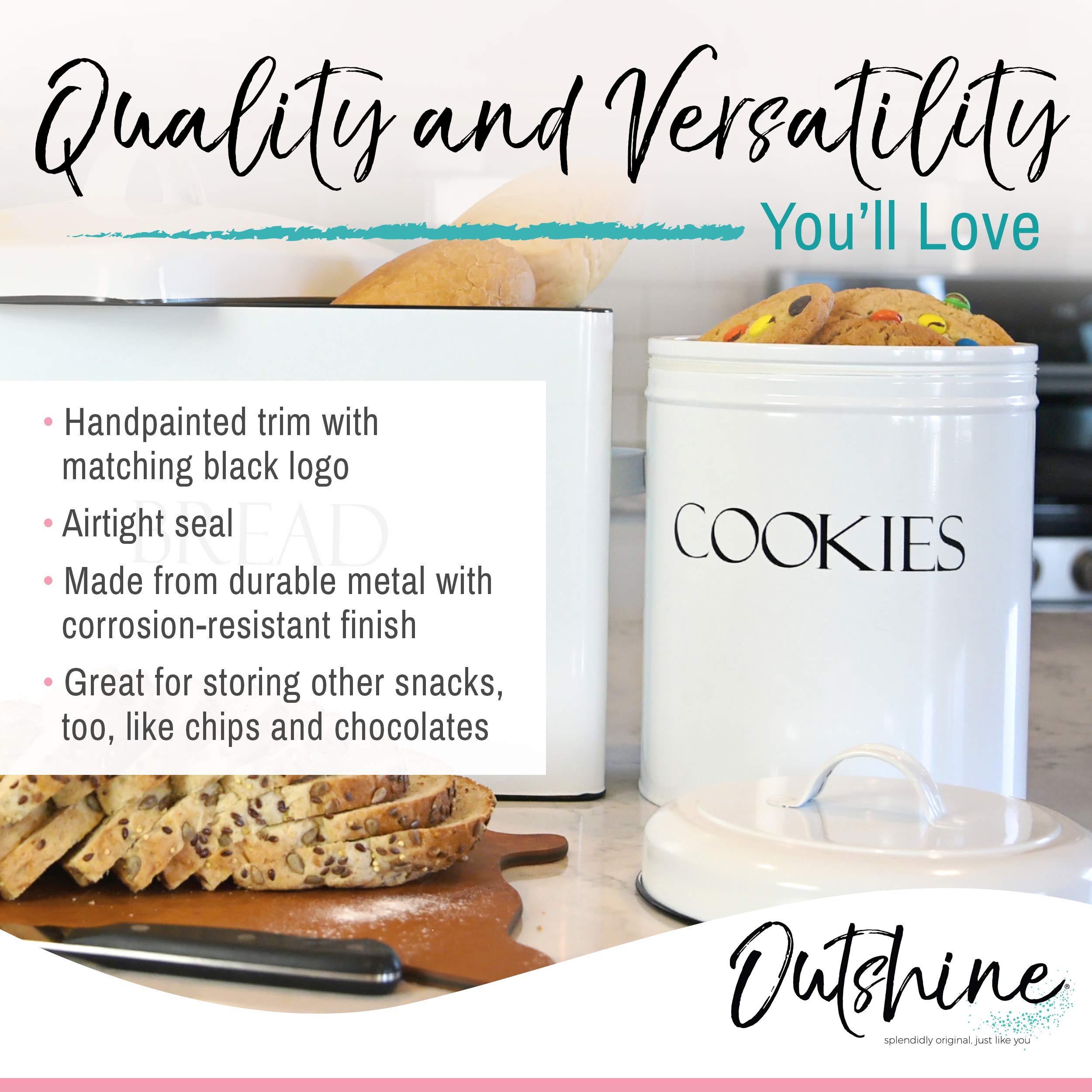 OUTSHINE cookie tin on countertop with two heart-shaped cutters for cookies.