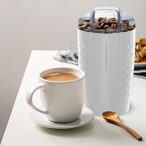 Transparent lid with safety lock helps monitor grind texture safely.