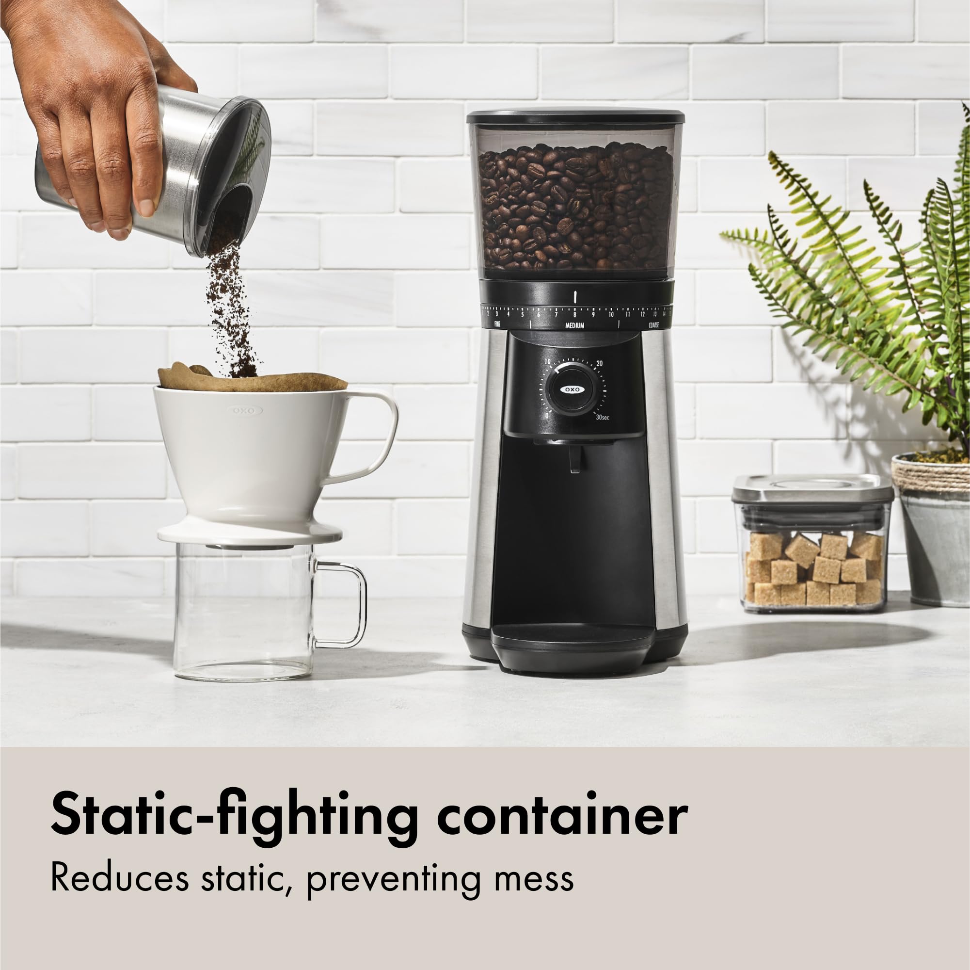 OXO Brew grinder hopper filled, showcasing 12-ounce bean capacity.