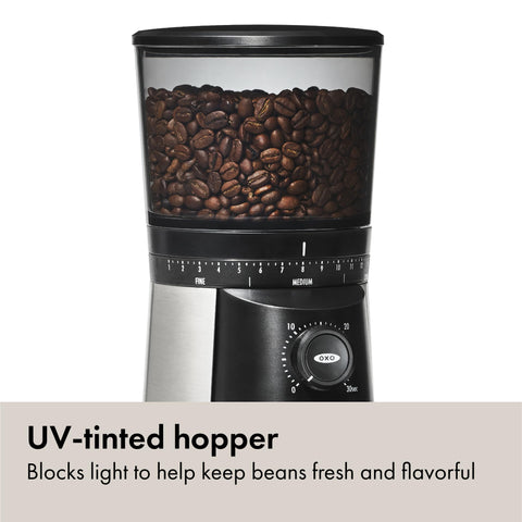 OXO Brew grinder with UV tint protecting beans in bright kitchen.