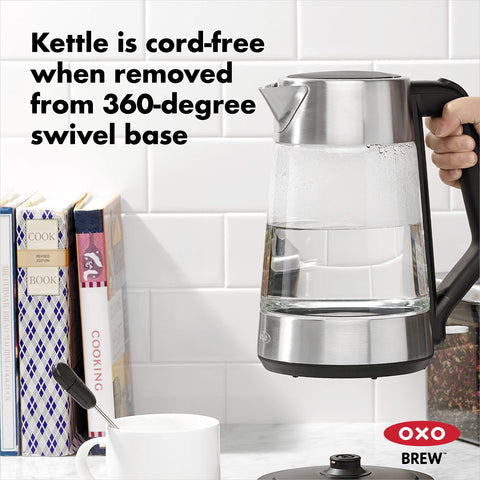 OXO Brew cordless glass kettle soft-open lid for controlled steam release.