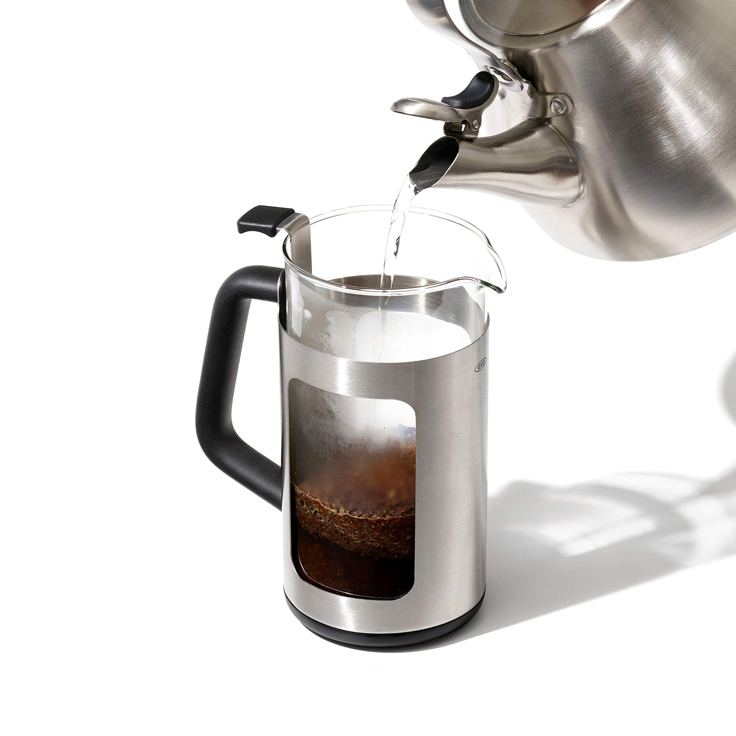 Pouring brewed coffee into a mug for a satisfying pour.