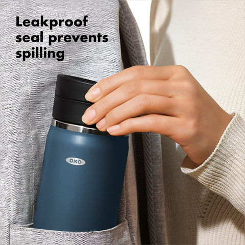 OXO Good Grips travel mug fits most cup holders for convenient commuting.