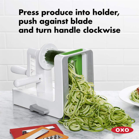 OXO rotating handle and folding side grip guide produce through blades.