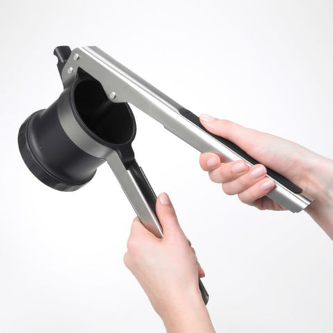 OXO Good Grips 3-in-1 grooved pot rest keeps the ricer steady on bowls.