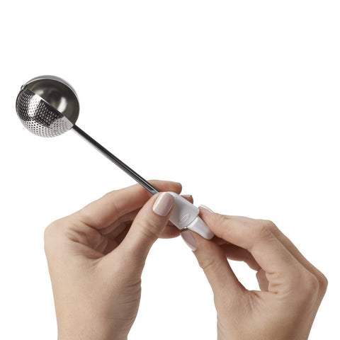 OXO Good Grips Baker’s Dusting Wand solid side rests on the counter