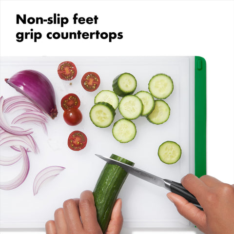 OXO Good Grips cutting board with integrated drip-catcher minimizes juices and mess.