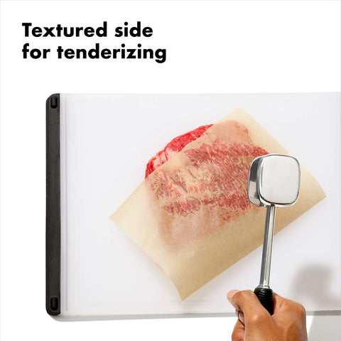 OXO Good Grips die-cast tenderizer smooth side for even flattening.