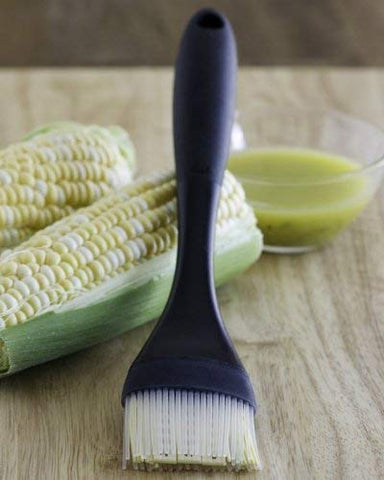 OXO Good Grips dishwasher-safe brush cleans easily without odor retention