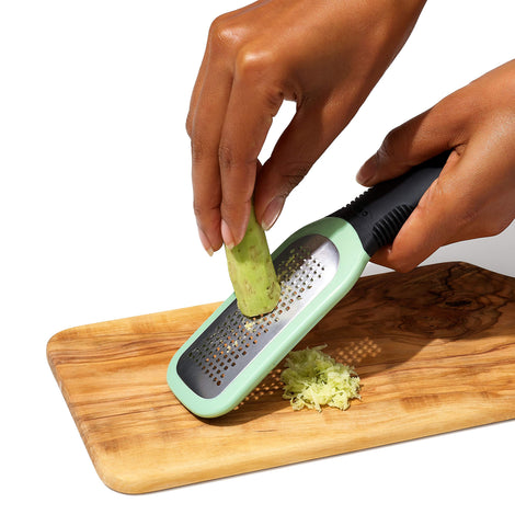 OXO Good Grips ginger paste on the grater ready for the pan.