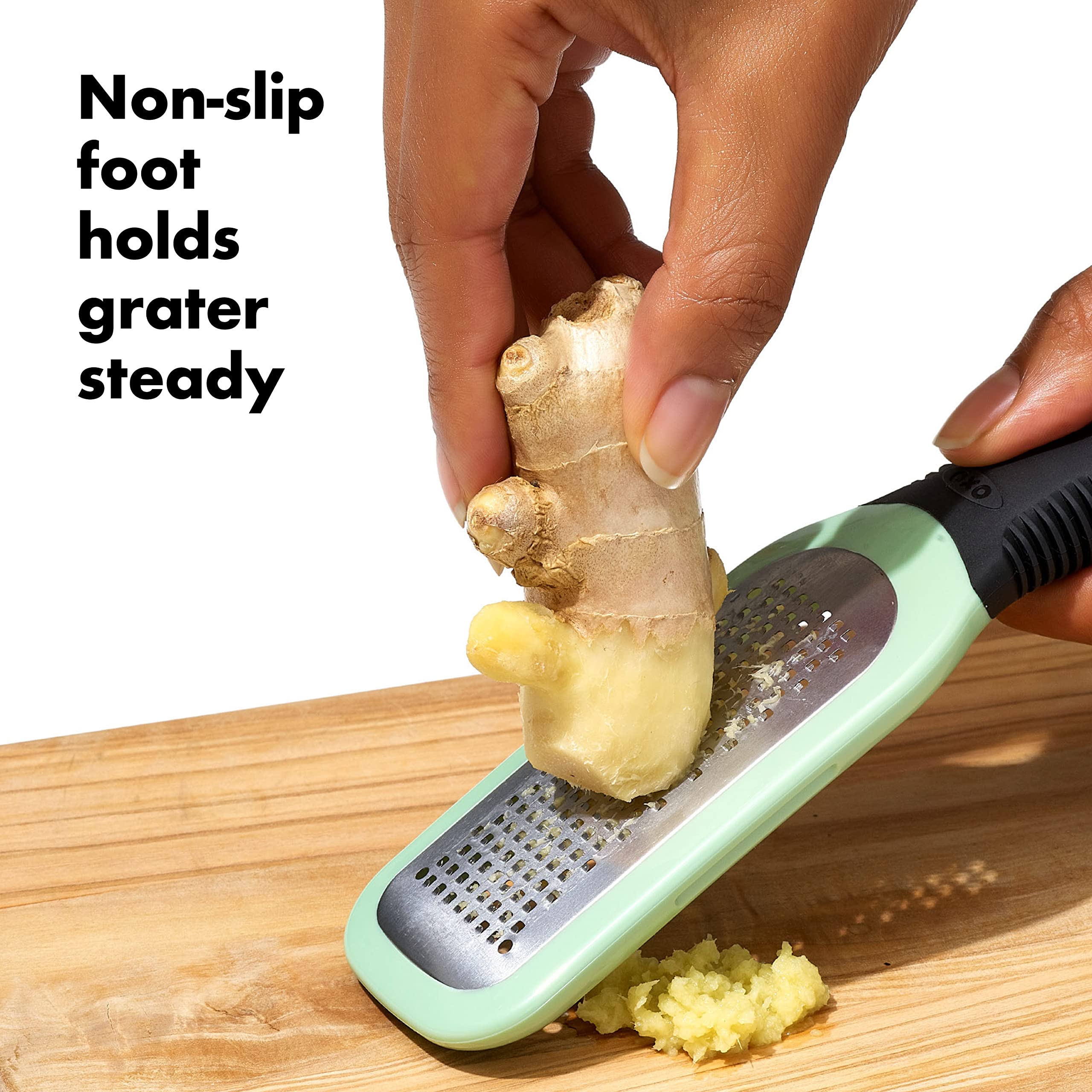 OXO Good Grips grater's non-slip foot enhances control during garlic grating.