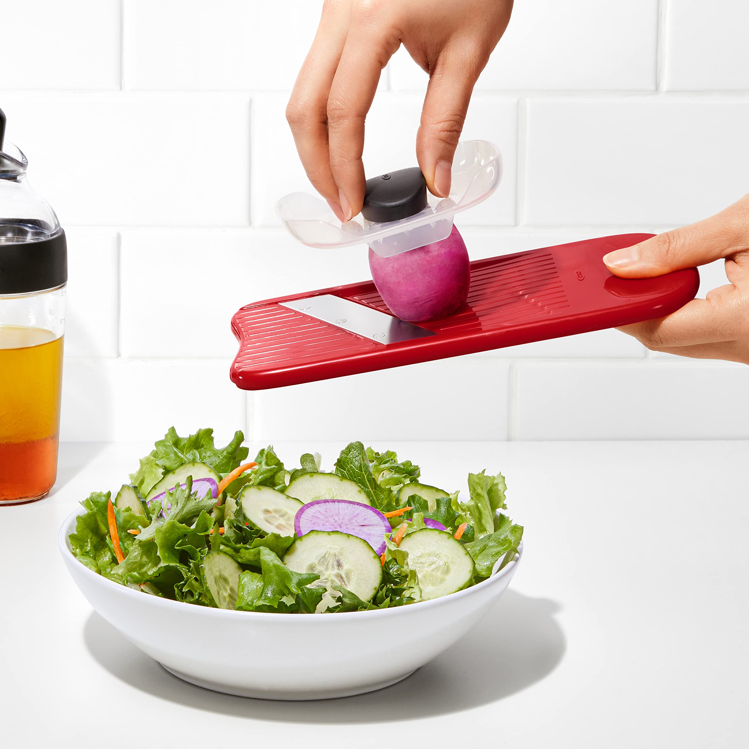 OXO Good Grips food holder safety feature helping steady slicing
