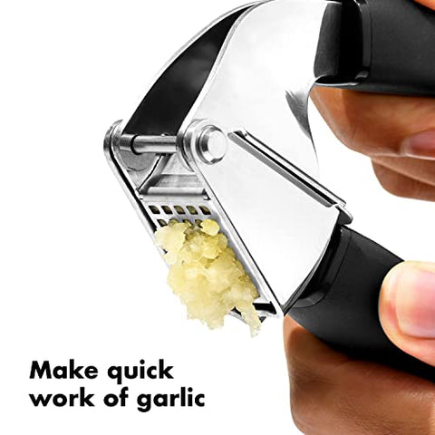OXO Good Grips Garlic Press swing basket makes emptying easy