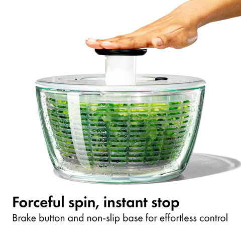OXO Glass salad spinner lid locks flush for compact storage.