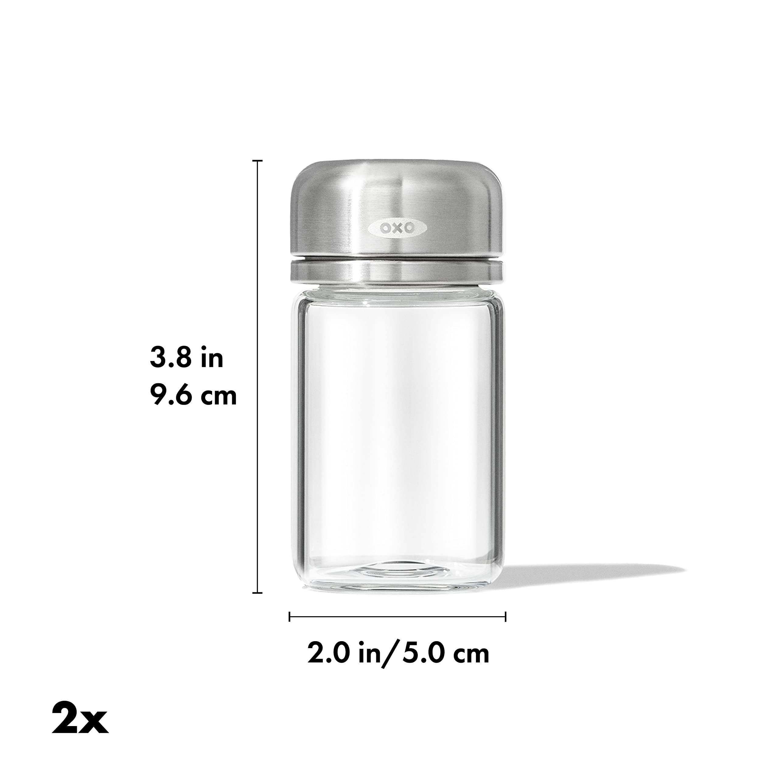 OXO Good Grips glass shaker in use with three-hole lid for controlled seasoning during cooking.