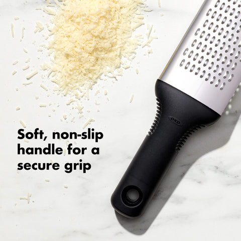 OXO Good Grips Grater efficiently grates hard cheeses, zucchini, and carrots for recipes.