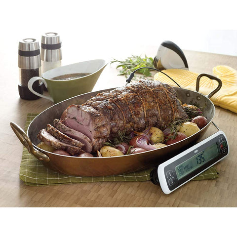 OXO Good Grips salt and pepper grinders shown being refilled.