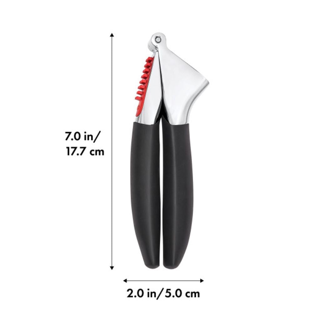 OXO Good Grips garlic press in-use view showcasing efficient garlic crushing
