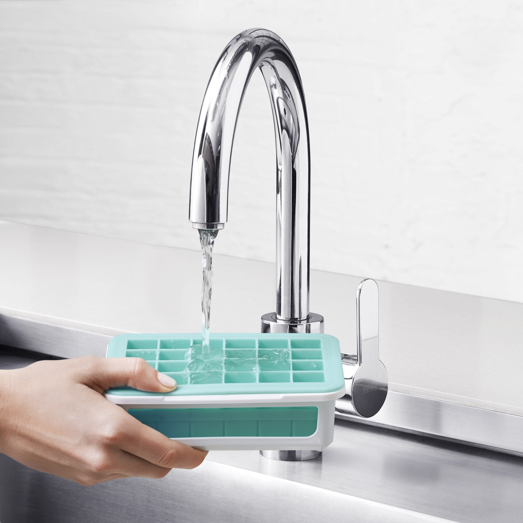 OXO Good Grips silicone tray enables effortless ice release.