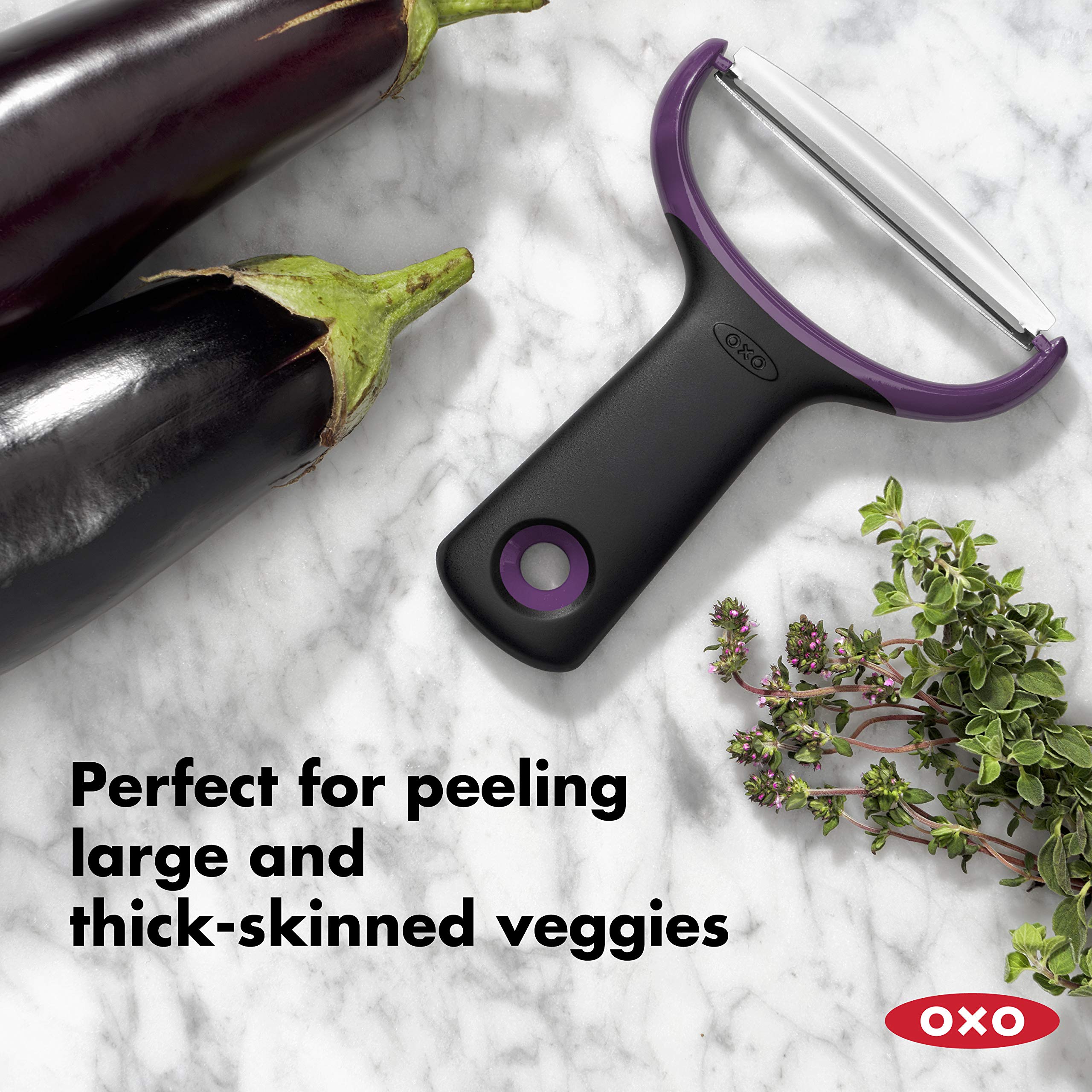 OXO Good Grips peeler with non-slip grip in action on thick-skinned produce.