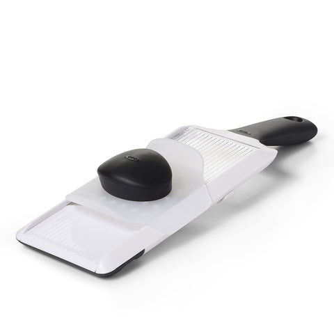 OXO Good Grips Mandoline Slicer set to 1mm for precise vegetable slices on plates
