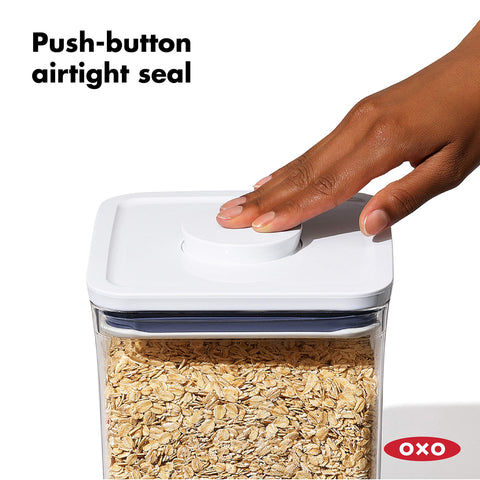 Push-button seal and lid handle for quick, reliable access to spices