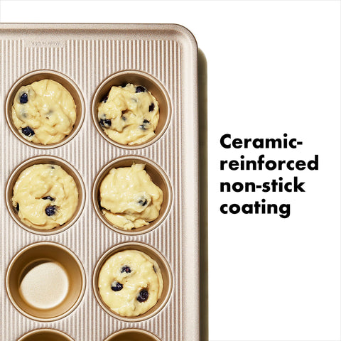 OXO Good Grips muffin pan side shot emphasizes square-rolled edges for secure handling.