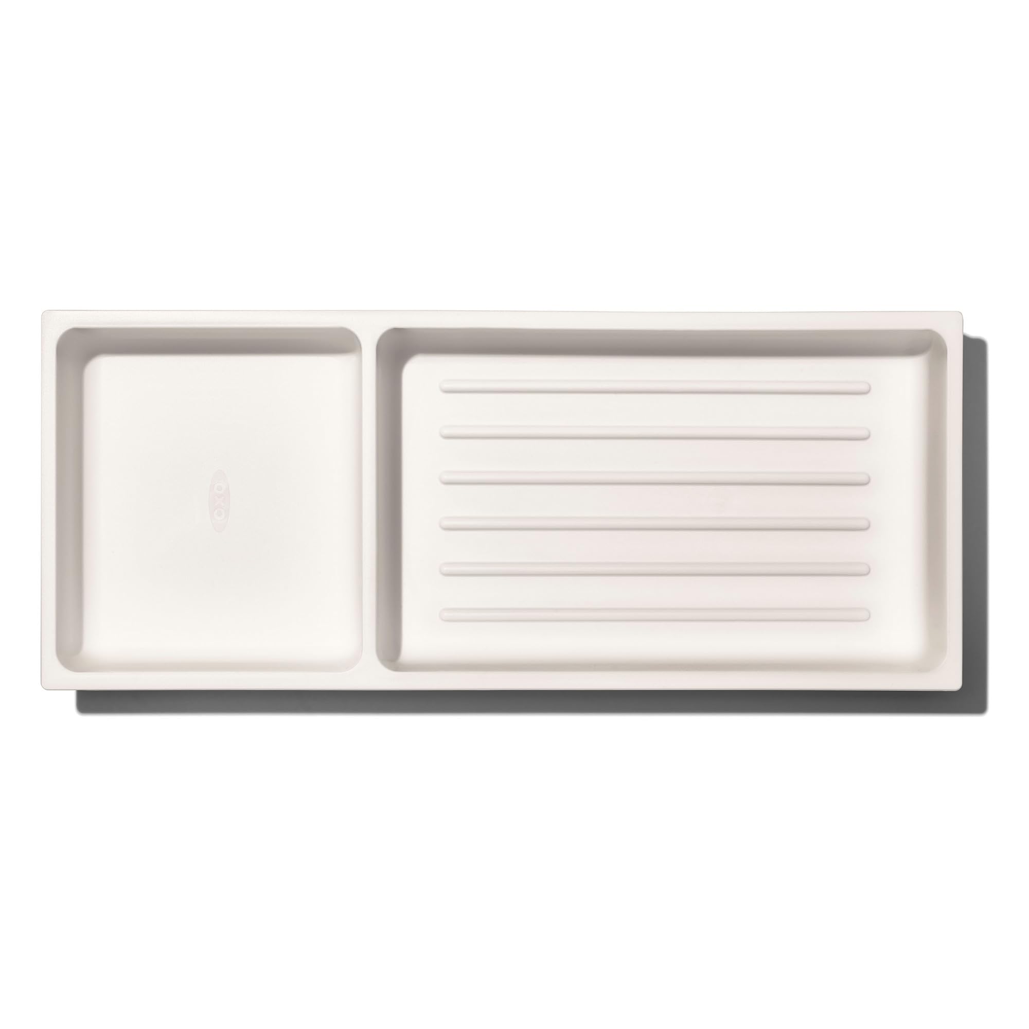 Non-slip feet secure the organizer inside the drawer during use and opening.