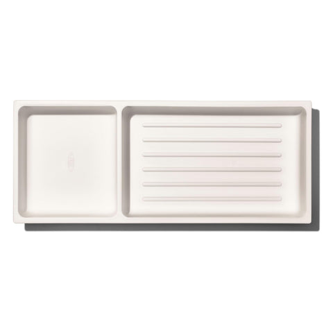 Non-slip feet secure the organizer inside the drawer during use and opening.